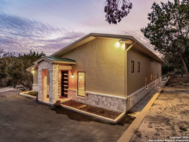 view of property exterior at dusk