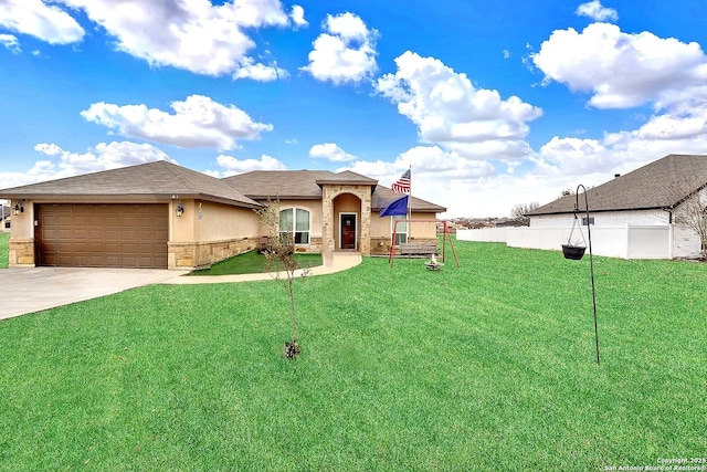 view of front of home with a garage and a front lawn