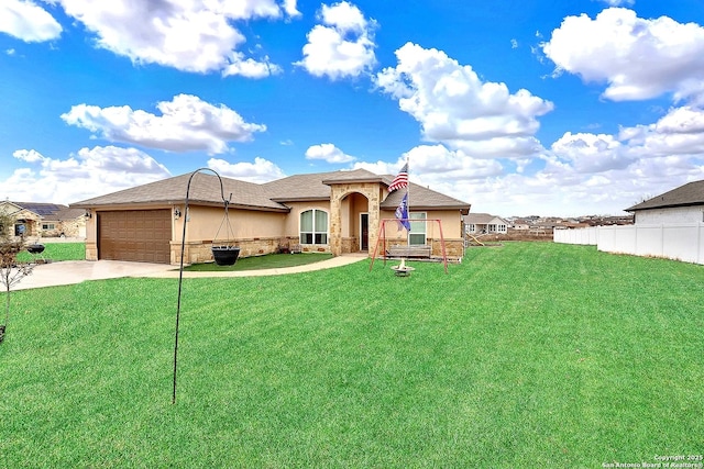 ranch-style home featuring a garage and a front lawn