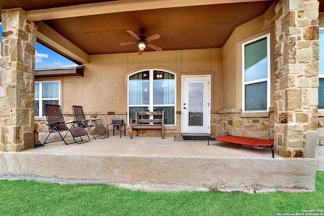 exterior space featuring ceiling fan