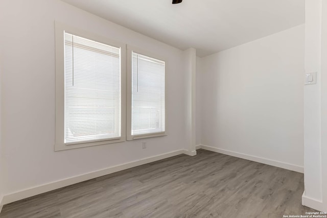 unfurnished room with light hardwood / wood-style flooring