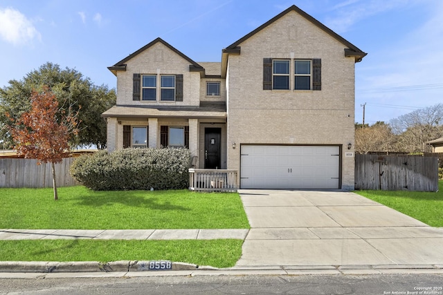 view of front of house featuring a garage and a front lawn