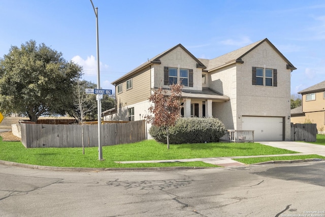 view of front of home with a garage and a front yard