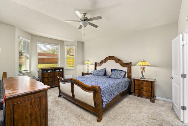 bedroom featuring light carpet and ceiling fan