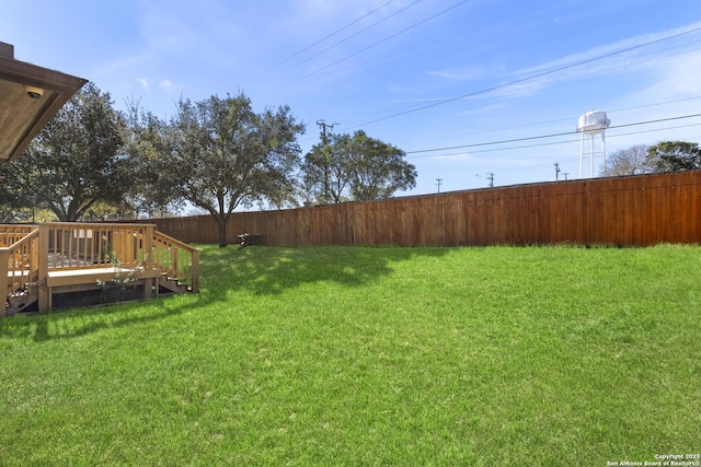 view of yard featuring a wooden deck