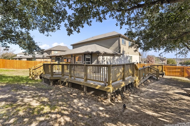 back of house with a wooden deck