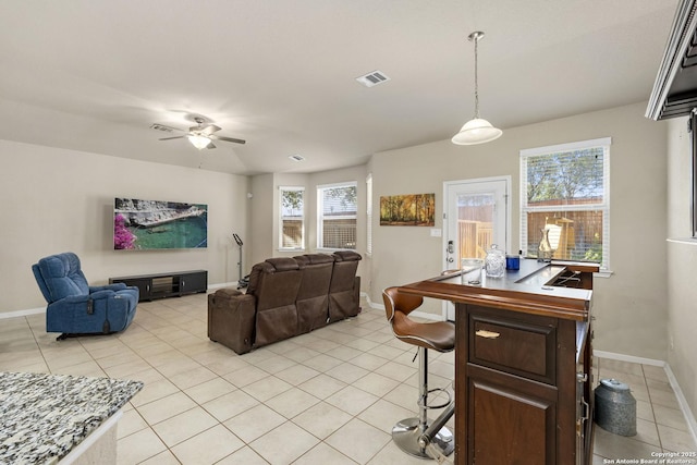 interior space featuring ceiling fan