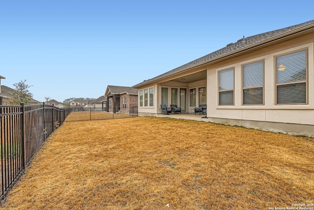 view of yard with a patio and a fenced backyard