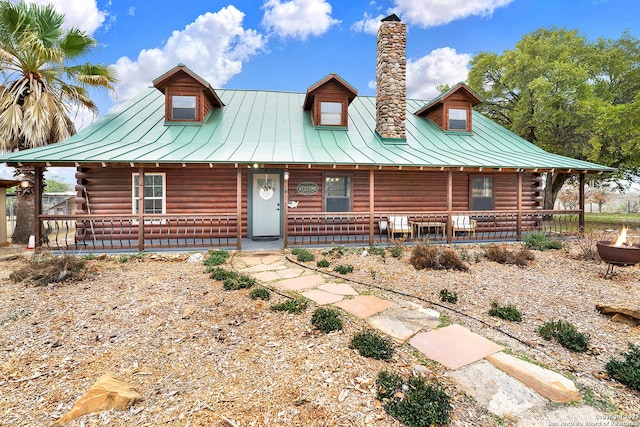 log-style house with a porch