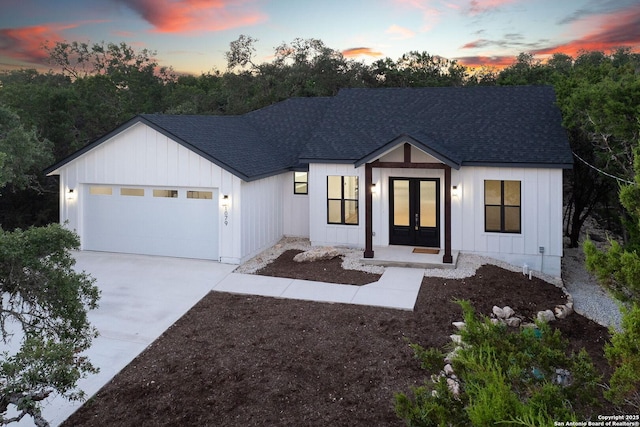 modern farmhouse style home featuring a garage