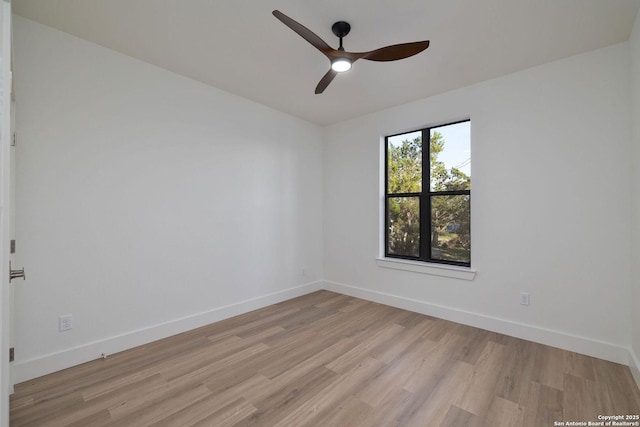 spare room with light hardwood / wood-style flooring and ceiling fan