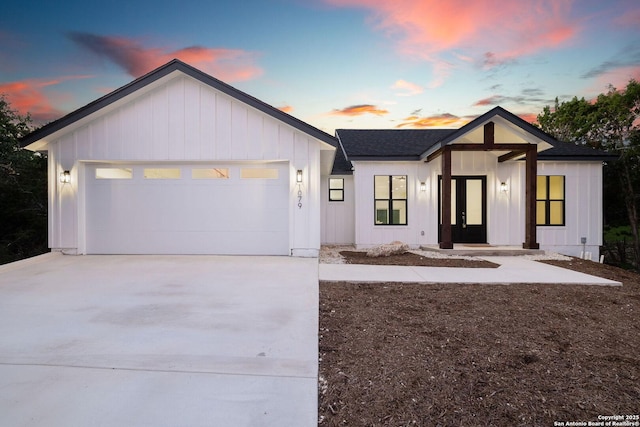 modern farmhouse style home featuring a garage