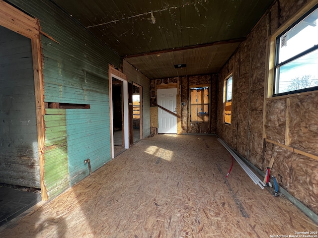 unfurnished room with wooden ceiling