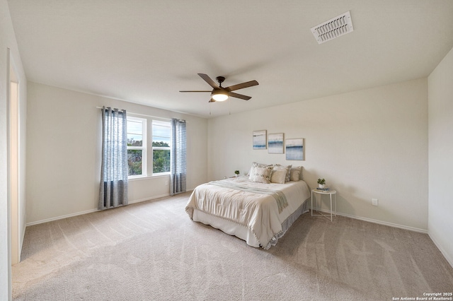 bedroom with ceiling fan and light colored carpet