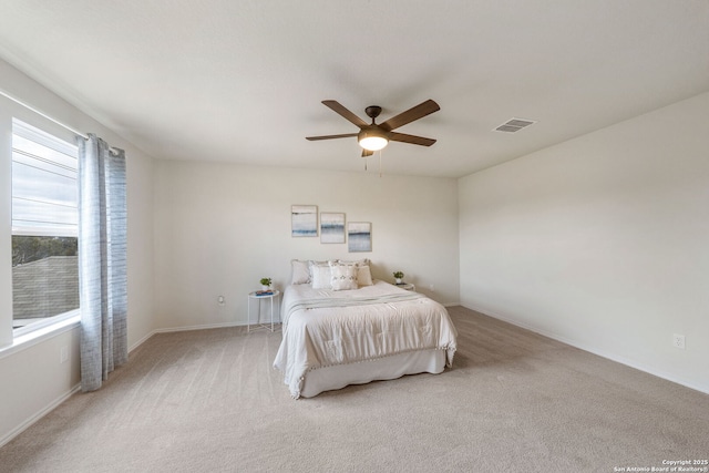 bedroom featuring ceiling fan and light colored carpet