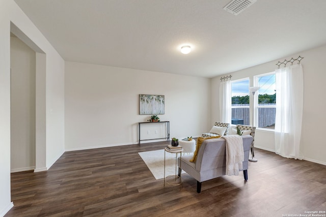 living room with dark hardwood / wood-style floors