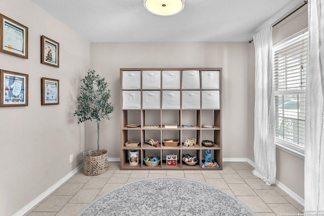 living area with light tile patterned floors