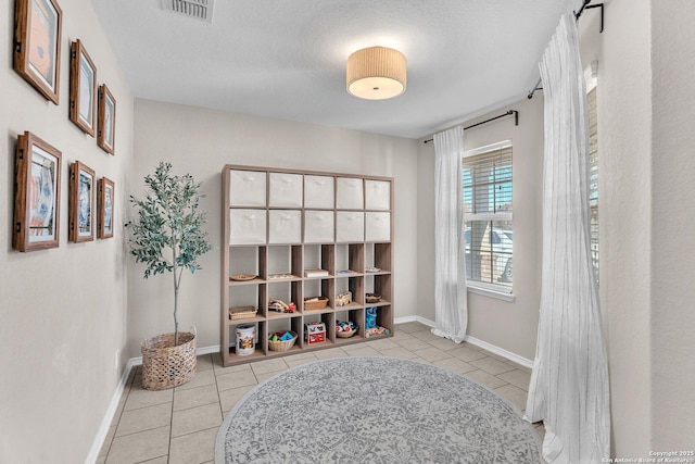 mudroom featuring light tile patterned floors