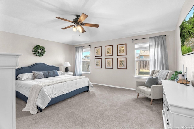 bedroom featuring light carpet and ceiling fan