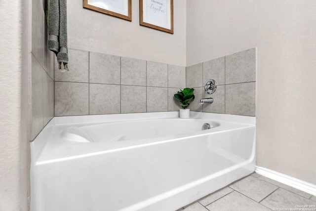 bathroom featuring tile patterned floors and a tub