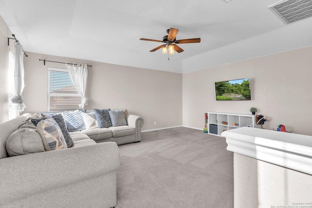 carpeted living room featuring ceiling fan