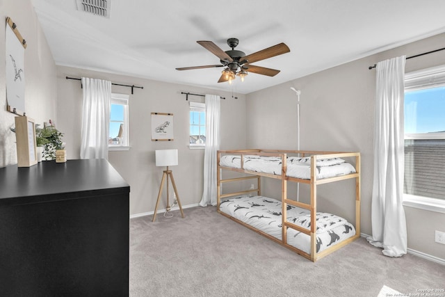 bedroom with light colored carpet and ceiling fan