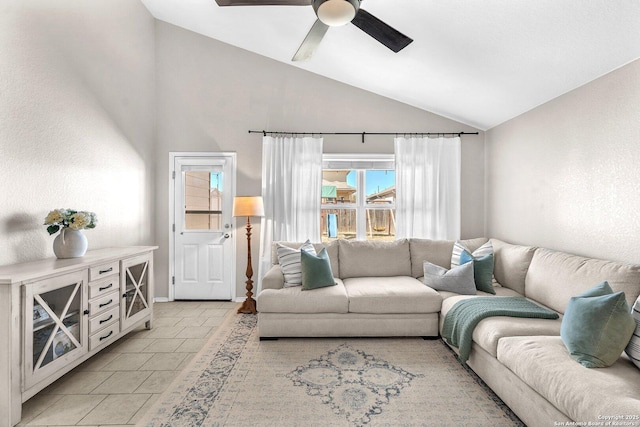 living room featuring vaulted ceiling and ceiling fan