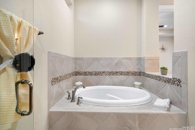 bathroom with a relaxing tiled tub