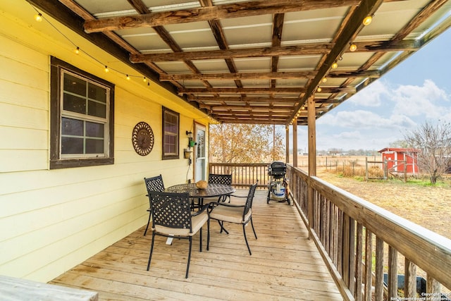 wooden terrace with area for grilling