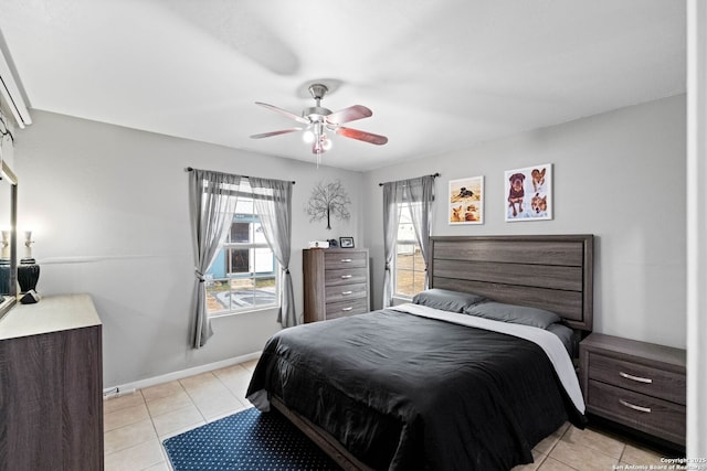 tiled bedroom with ceiling fan