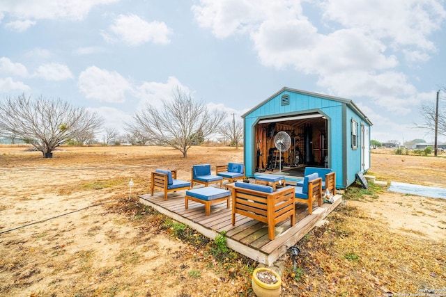 view of outbuilding with a rural view and an outdoor hangout area