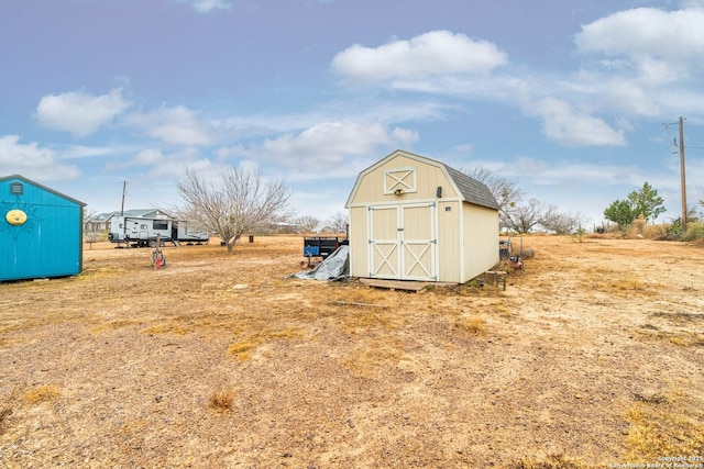 view of outbuilding featuring a rural view