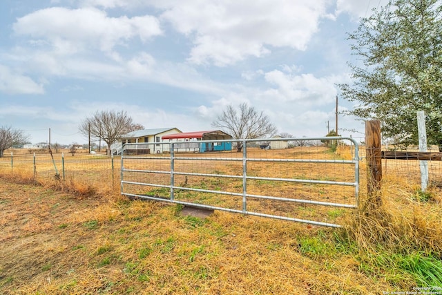 view of gate featuring a rural view