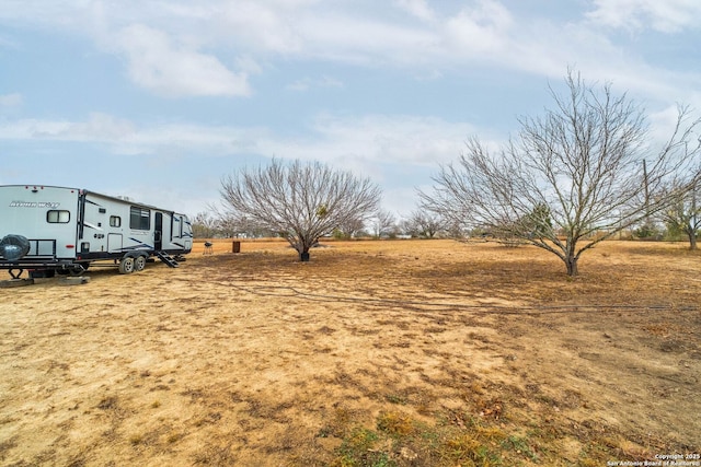 view of yard with a rural view