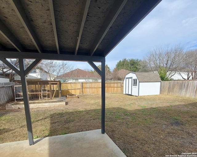 view of yard with a patio area and a shed