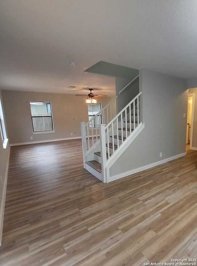 interior space with hardwood / wood-style flooring and ceiling fan