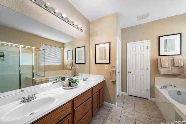 bathroom featuring separate shower and tub, tile patterned flooring, and vanity