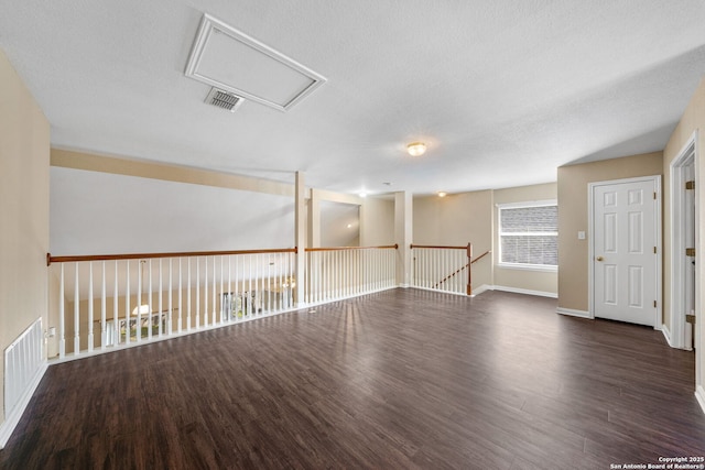 unfurnished room featuring dark hardwood / wood-style floors