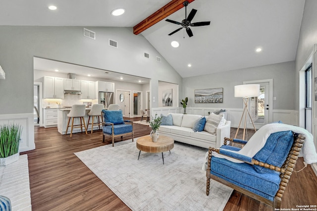 living room featuring ceiling fan, dark hardwood / wood-style floors, high vaulted ceiling, and beam ceiling