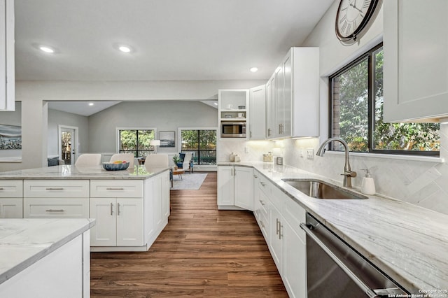 kitchen featuring white cabinetry, light stone countertops, sink, and appliances with stainless steel finishes