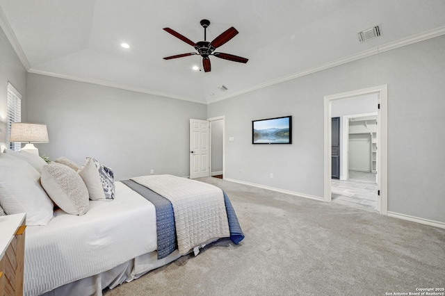 bedroom with lofted ceiling, a spacious closet, light colored carpet, ceiling fan, and crown molding