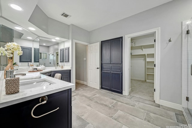 bathroom featuring vanity and walk in shower