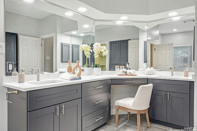 bathroom with vanity and tile patterned flooring