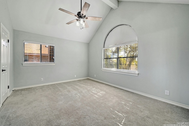 unfurnished room featuring plenty of natural light, light colored carpet, beamed ceiling, and ceiling fan