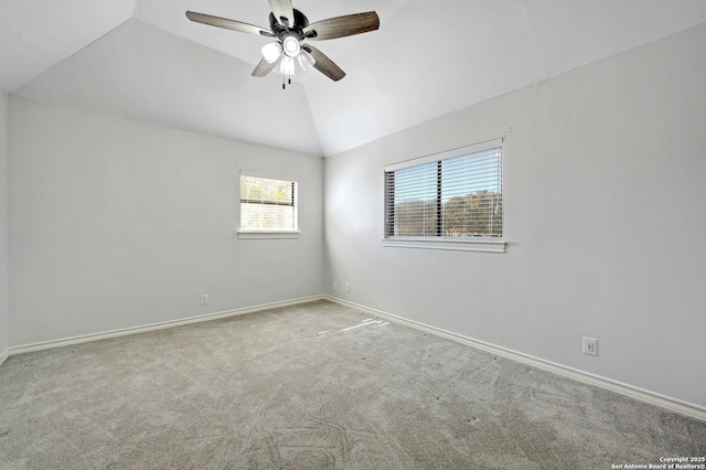 unfurnished room featuring lofted ceiling, light carpet, and ceiling fan