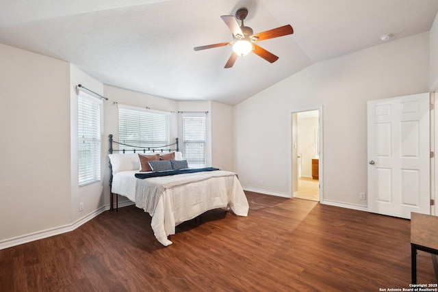 bedroom with dark hardwood / wood-style flooring, multiple windows, lofted ceiling, and ceiling fan