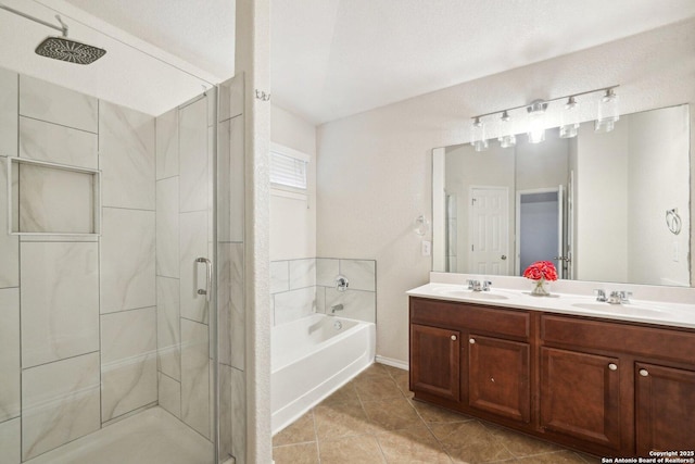 bathroom with plus walk in shower, tile patterned floors, and vanity