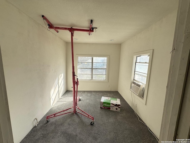 interior space with carpet floors and cooling unit