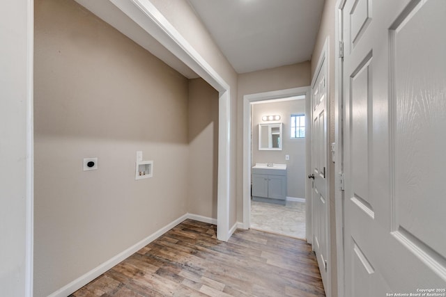 laundry room featuring laundry area, washer hookup, wood finished floors, baseboards, and electric dryer hookup