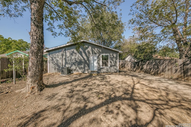 back of property with a fenced backyard